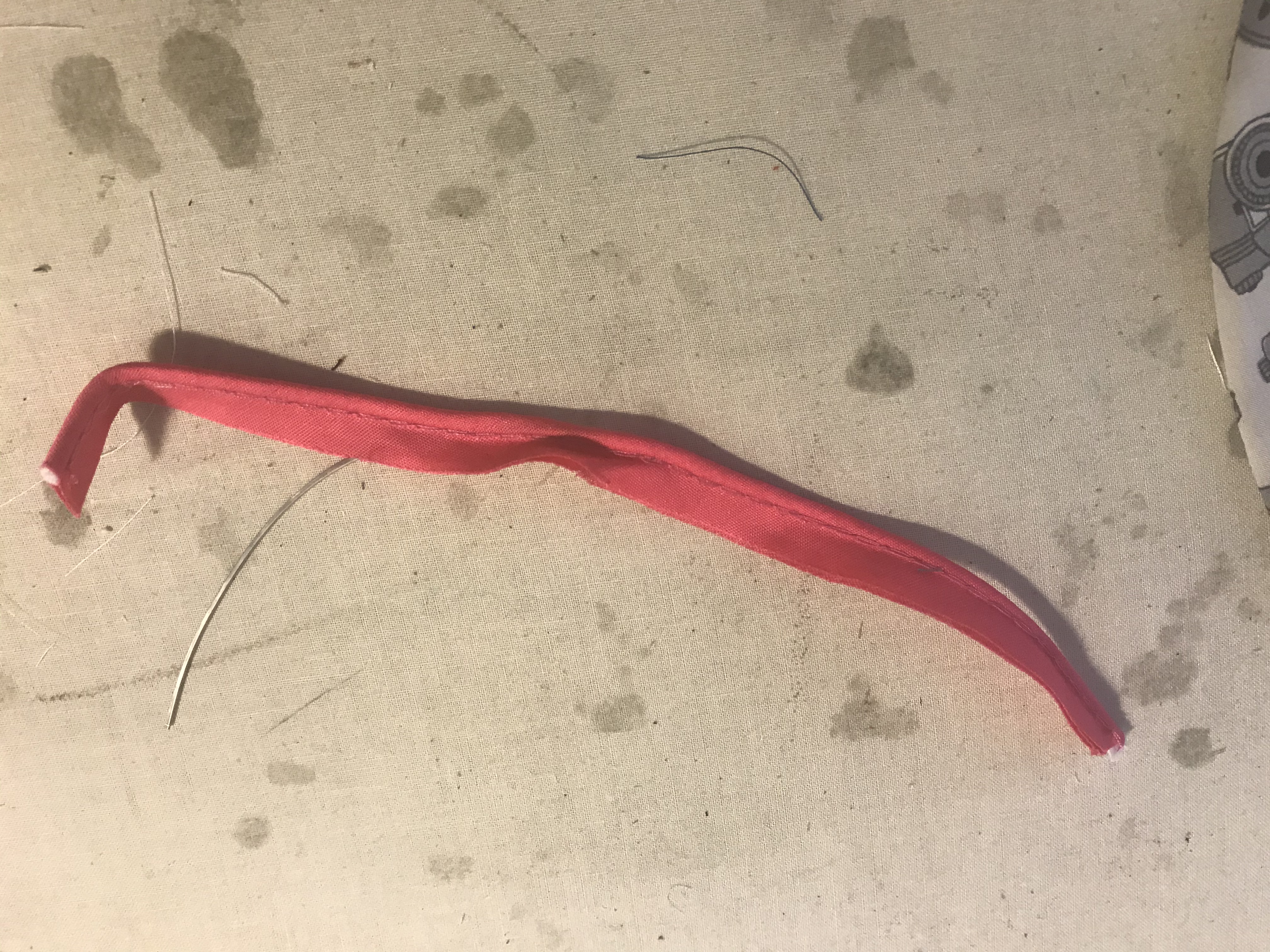 wire inserted partway into piping