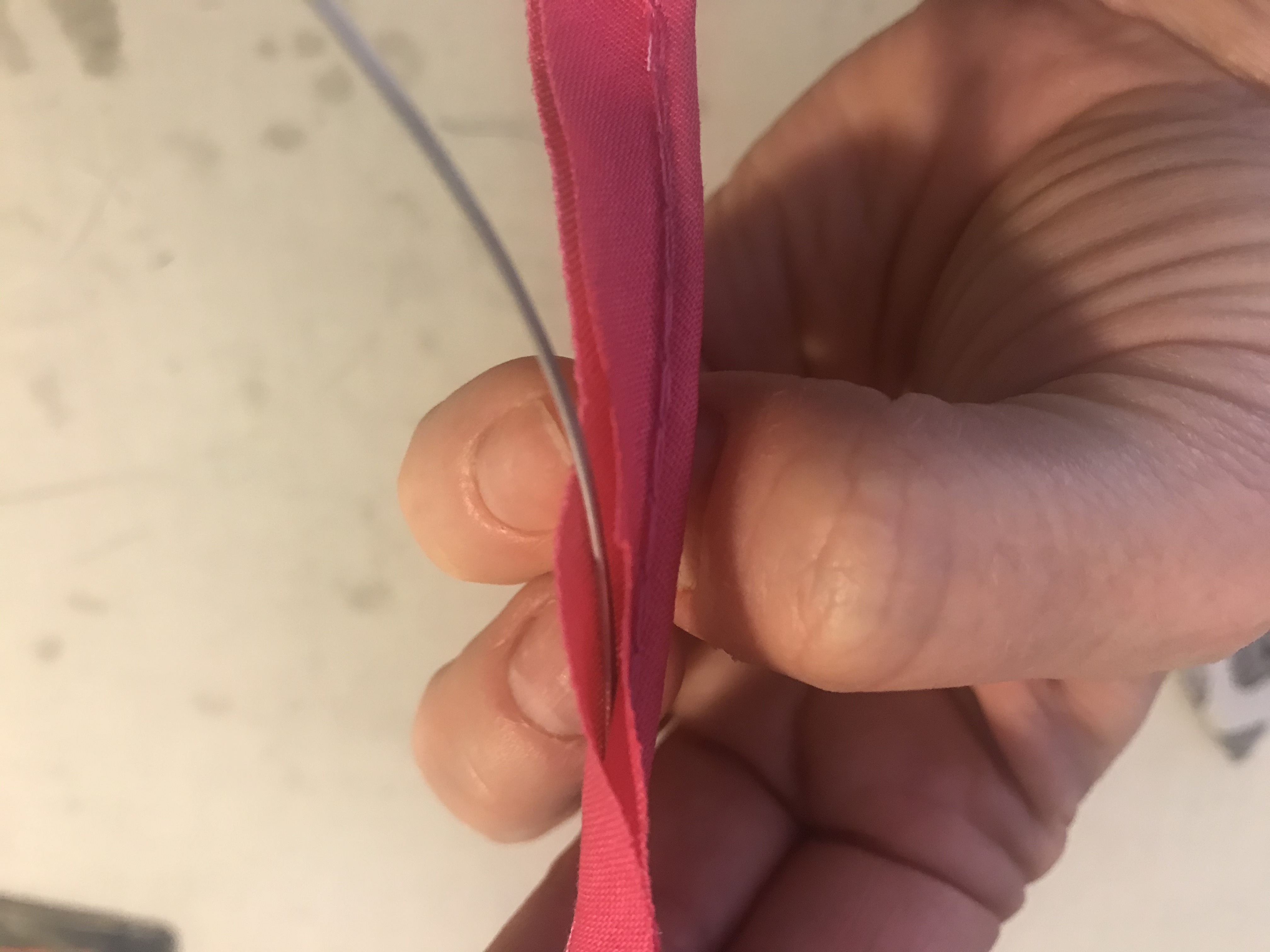 wire inserted between the stitches of the piping