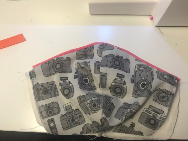 ok I lied about the pressing part, my iron wasn't hot right side of the mask, showing piped edge